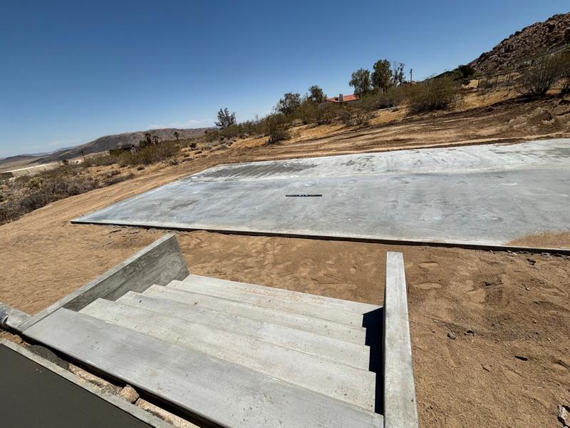 Hillside steps and slab by Dig Deep Concrete