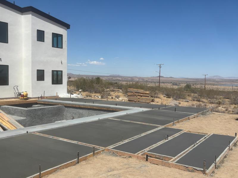 Multi-section pool deck by Dig Deep Concrete